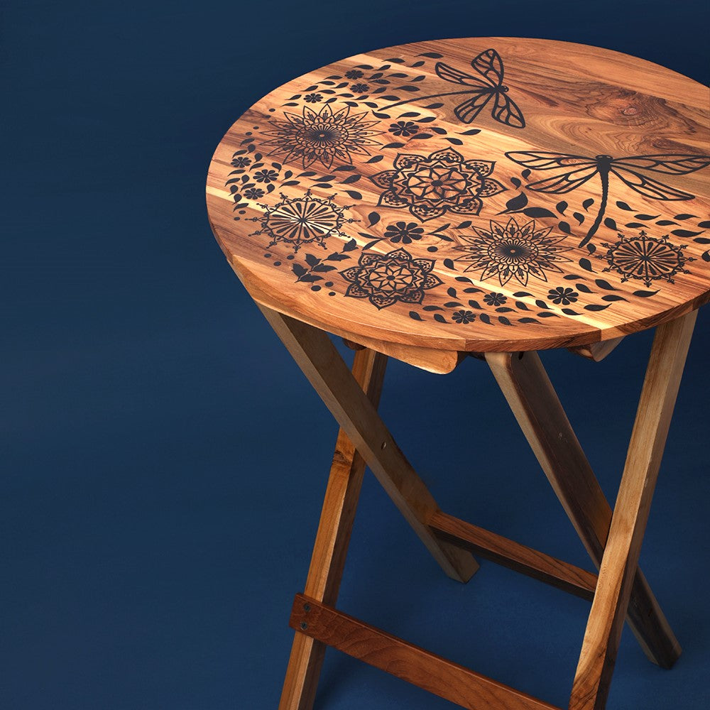 Transform any space with our versatile Dragonfly Mandala Round Folding Table – a stunning 100% Teak Wood creation, perfect as a coffee table, sofa side table, bed side table, or balcony centrepiece.