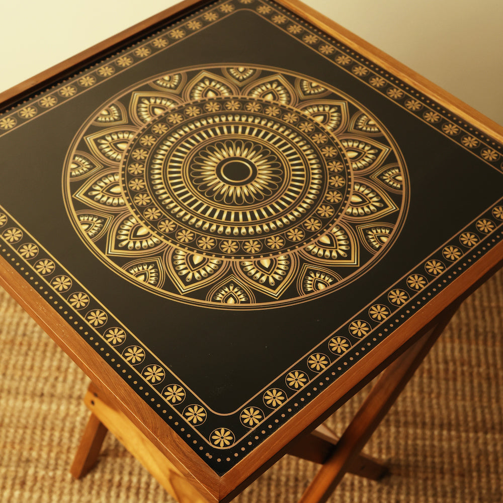 Elegant folding table with gold and black design
